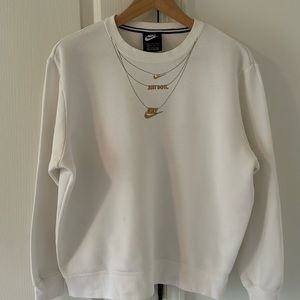 Gently worn Women’s Nike XS sweatshirt. White with gold.